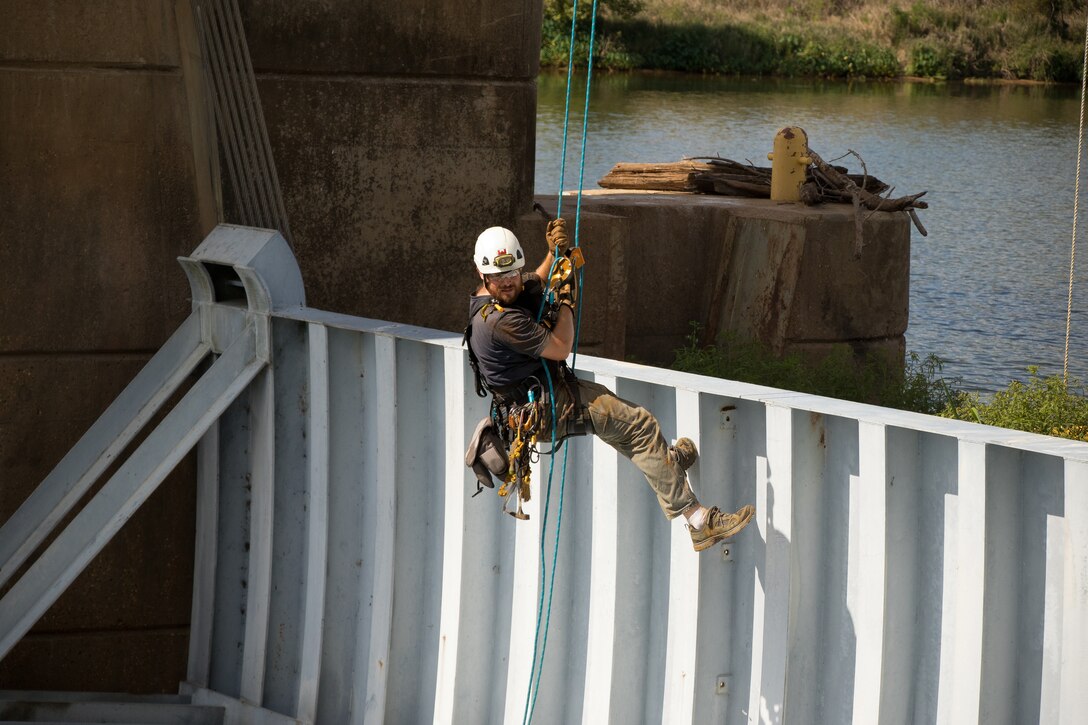 Personnel from the U.S. Army Corps of Engineers Vicksburg District inspect and perform maintenance during a complete dewatering of the John H. Overton Lock and Dam, located on the Red River near Alexandria, Louisiana, Sept. 26.