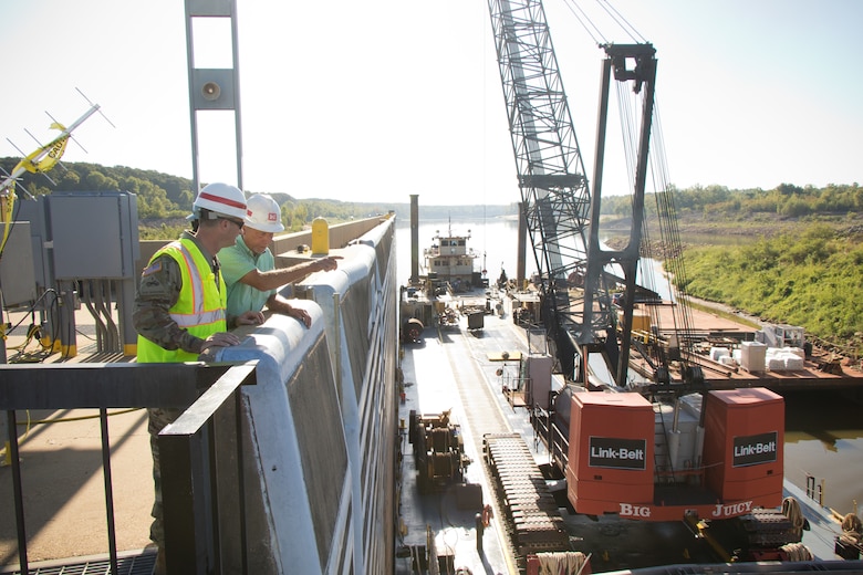 U.S. Army Corps of Engineers Vicksburg District Commander Col. Robert A. Hilliard speaks with a district engineer regarding the complete dewatering of the John H. Overton Lock and Dam, located on the Red River near Alexandria, Louisiana, Sept. 26.