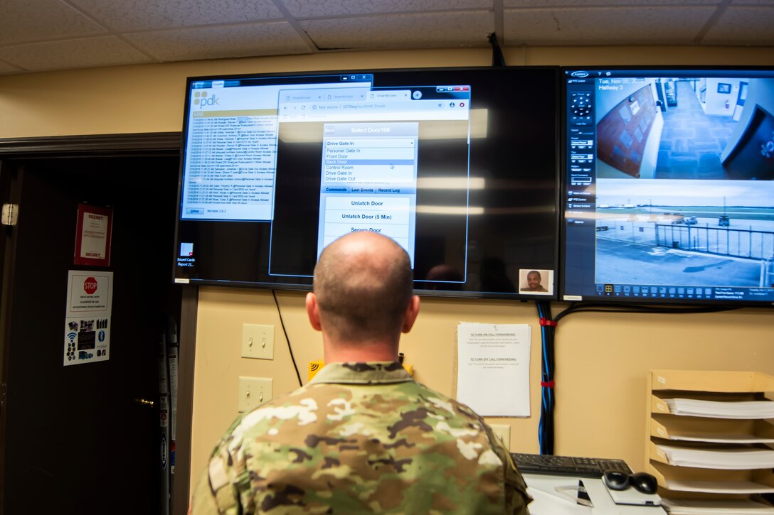 Tech. Sgt. Carl Slater, 23d Maintenance Squadron senior munitions controller, opens a gate remotely Nov. 7, 2019, at Moody Air Force Base, Ga. The Munitions Flight Systems Division is responsible for maintaining the security of ‘Ammo Country’ as well as tracking munitions and orders from around Moody. Airmen assigned to this division control security gates, escort visitors and communicate with flying squadrons to determine munitions needs. (U.S. Air Force photo by Airman Elijah M. Dority)