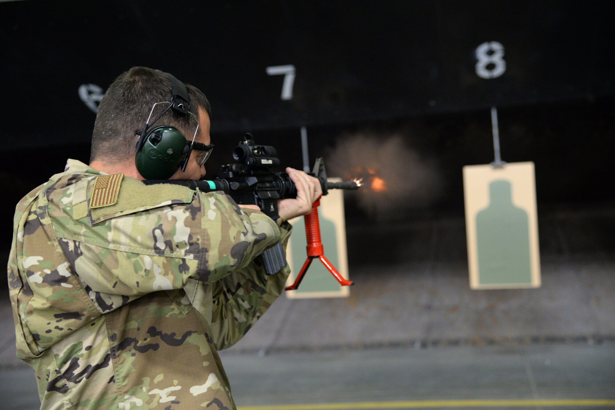 A picture of U.S. Air Force Lieutenant Colonel Joseph Leonard, 177th Maintenance Group commander, firing the M4 carbine at a firing range.