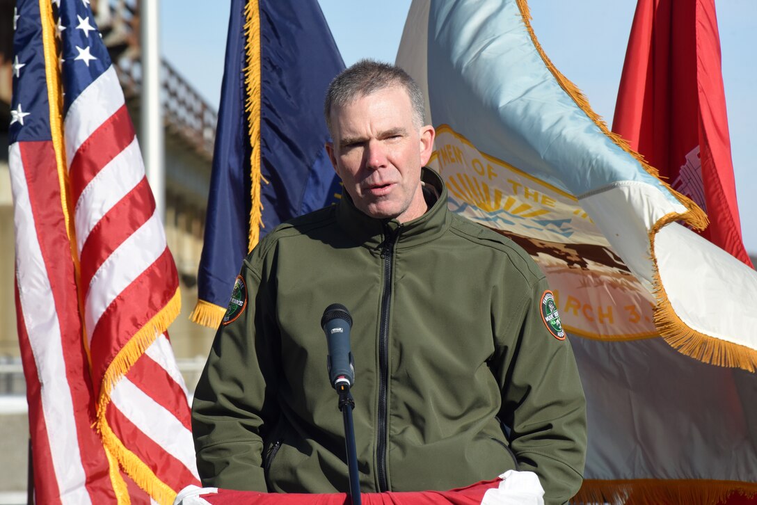 Frank Fiss, Tennessee Wildlife Resources Agency Fisheries chief, speaks speaks during a commissioning ceremony for a bio-acoustic fish fence Nov. 8, 2019 below Barkley Lock in Grand Rivers, Ky. The BAFF sends a curtain of bubbles, sound and light from the riverbed to the water surface, which deters noise-sensitive Asian carp from entering the lock chamber. Fisheries managers on the west coast of the United States use a similar system to guide the movement of trout and salmon from water channels. This marks the first time a BAFF has been tested at a lock and dam on a large river. Construction of the BAFF began in July 2019. The project involves multiple partners, including U.S. Fish and Wildlife Service, Kentucky Department of Fish and Wildlife Resources, U.S. Army Corps of Engineers Nashville District, U.S. Geological Survey, and Tennessee Wildlife Resources Agency. Fish Guidance Systems, a United Kingdom-based company specializing in fish deflection and guidance systems, provided the BAFF technology at Barkley Lock.  The BAFF sends a curtain of bubbles, sound and light from the riverbed to the water surface, which deters noise-sensitive Asian carp from entering the lock chamber. Fisheries managers on the west coast of the United States use a similar system to guide the movement of trout and salmon from water channels. This marks the first time a BAFF has been tested at a lock and dam on a large river. Construction of the BAFF began in July 2019. The project involves multiple partners, including U.S. Fish and Wildlife Service, Kentucky Department of Fish and Wildlife Resources, U.S. Army Corps of Engineers Nashville District, U.S. Geological Survey, and Tennessee Wildlife Resources Agency. Fish Guidance Systems, a United Kingdom-based company specializing in fish deflection and guidance systems, provided the BAFF technology at Barkley Lock.  (USACE photo by Lee Roberts)