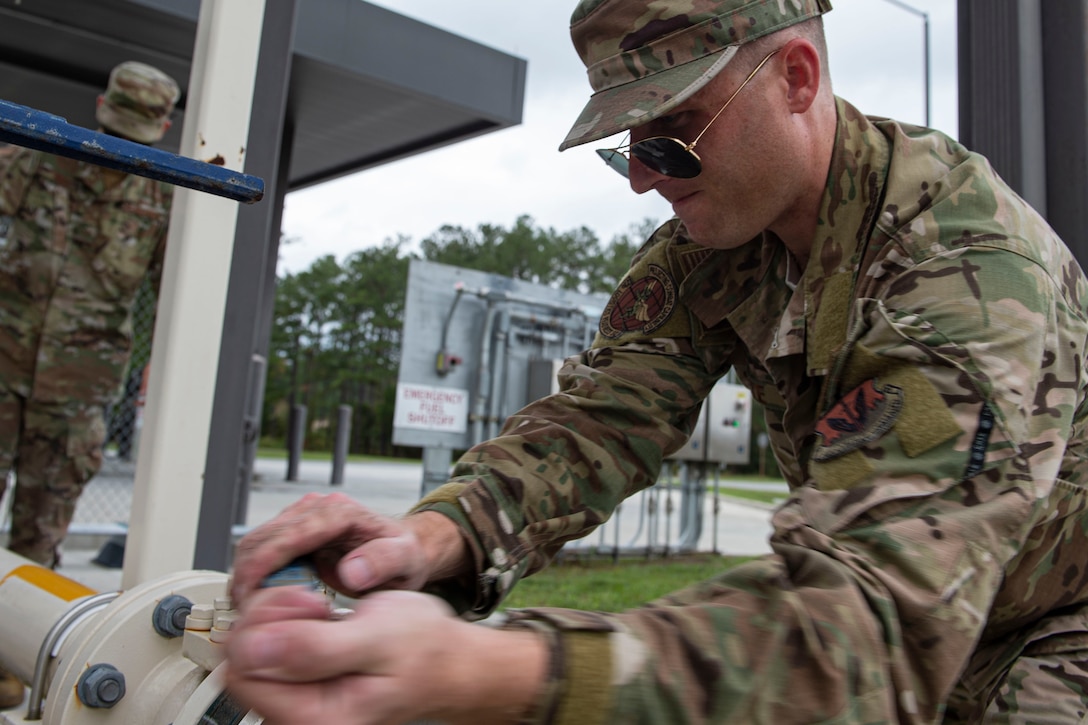 Staff Sgt. Bryan White, 23d Logistics Readiness Squadron (LRS) fuels facilities NCO in charge, turns an operating valve Oct. 30, 2019, at Moody Air Force Base, Ga. The 23d LRS fuels facilities is responsible for maintaining facilities, product purity, storage and accountability. Fuels facilities Airmen maintain the base service station by performing routine checks on the operating valves, fuel tanks and service station parts. (U.S. Air Force photo by Airman Azaria E. Foster)