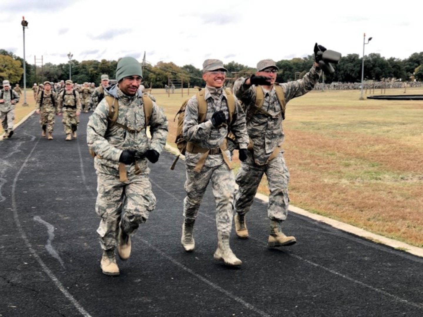 Security Forces Airmen celebrate crossing the finish line after a 4-mile ruck. Over 1,100 Security Forces Airmen gathered for the 12th Annual Defender Ruck, hosted by the 343rd Training Squadron, in honor of all 186 Defender Airmen who have made the ultimate sacrifice in defense of freedom, Nov. 8, here.