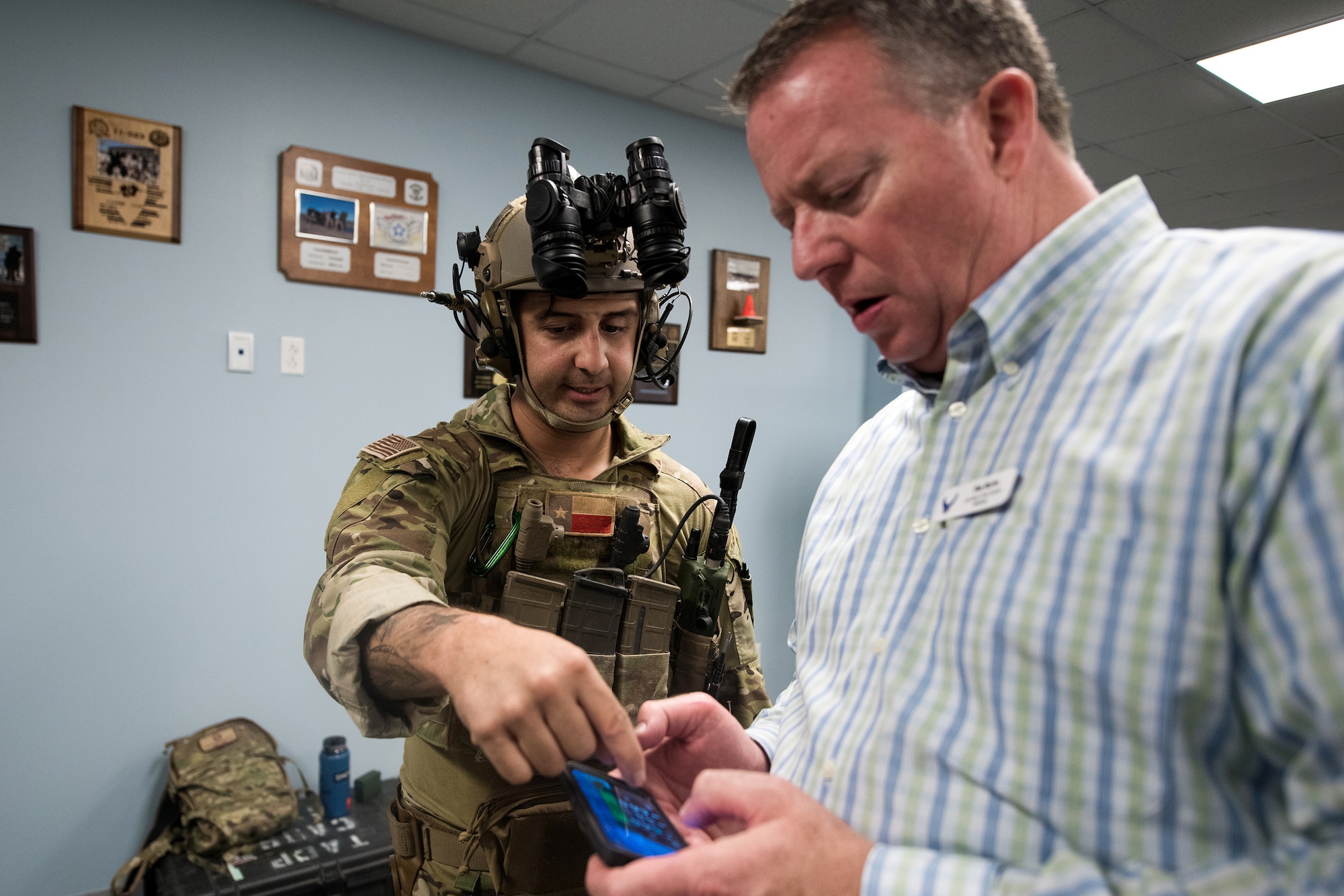 U.S. Air Force Staff Sgt. Nicholas Vead, 353rd Special Warfare Training Wing, Tactical Air Control Party instructor, demonstrates his equipment for Tim Burke, Air National Guard Bureau civic leader from Bellevue, Nebraska, Nov. 7, 2019, at Joint Base San Antonio-Medina Annex, Texas. During the visit, civic leaders toured missions of 37th Training Wing, 12th Flying Training Wing, 502nd Air Base Wing and Air Force Recruiting Service, all at JBSA locations. The Air Force Civic Leader Program is an Air Staff-level program comprising major command-selected community leaders from a wide variety of industries and sectors, including banking and economic development, construction, manufacturing, education, healthcare, science and technology. The program helps community leaders understand and advocate for the Air Force's diverse missions.