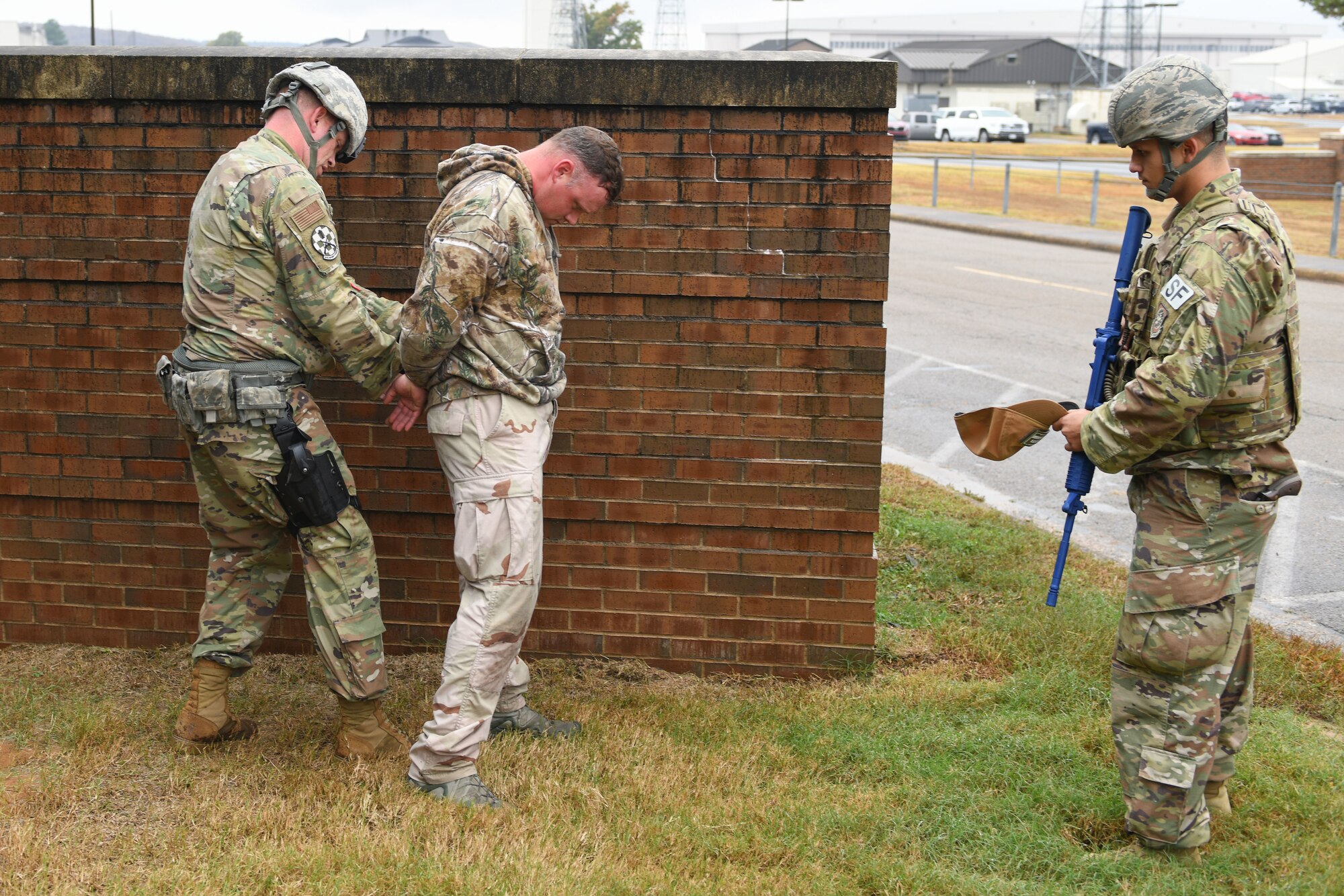 Men in uniform have weapon.