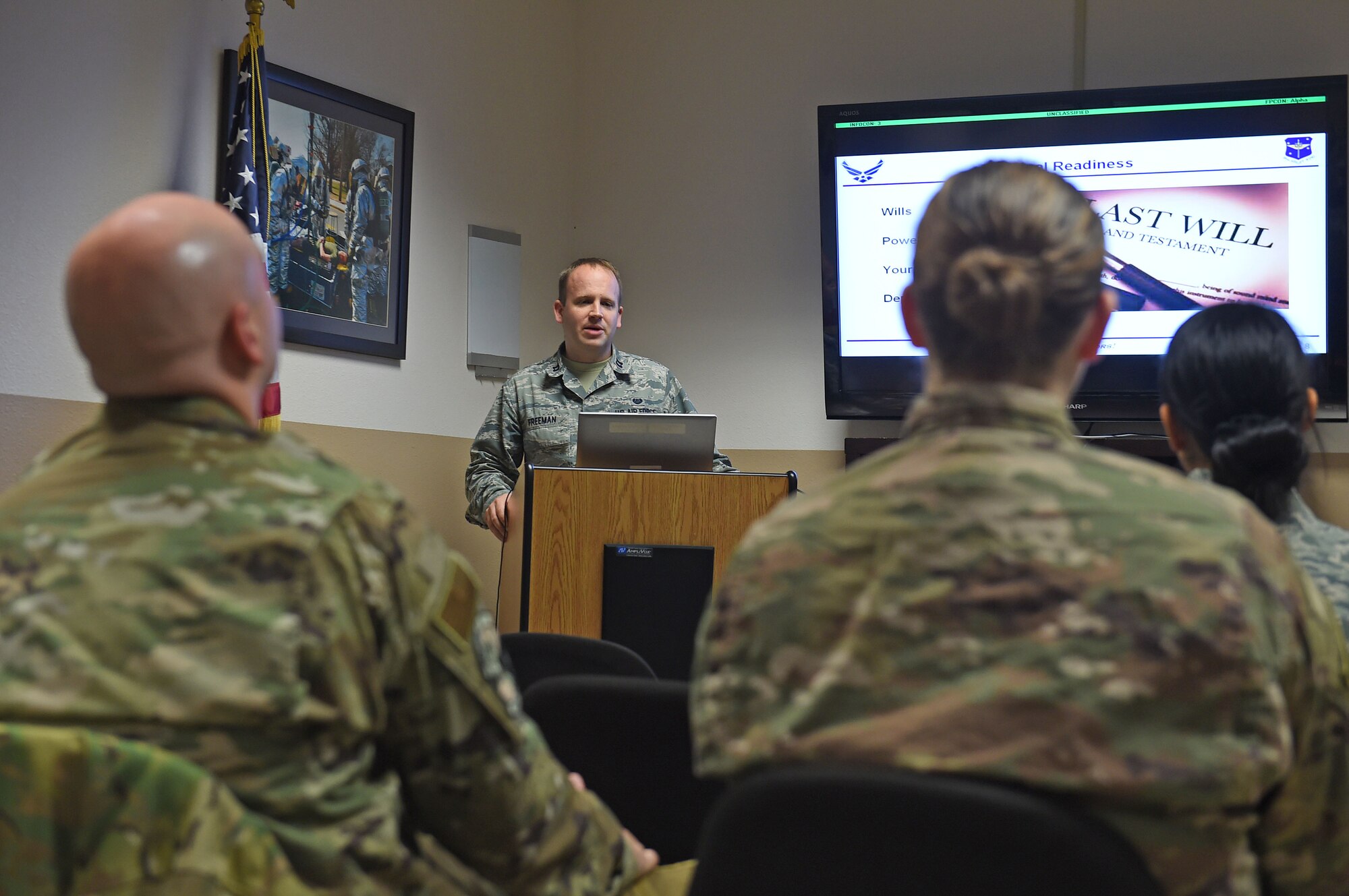 A man briefs an audience.