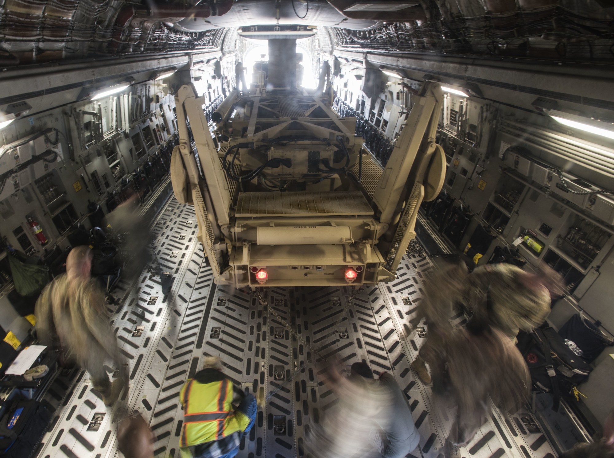 Soldiers with the 3rd Battalion, 2nd Air Defense Artillery Regiment assigned to Fort Sill, Oklahoma, and 6th Airlift Squadron Airmen assigned to Joint Base McGuire-Dix-Lakehurst, New Jersey, load a Fort Sill M902 Patriot Missile Launcher pulled by a HEMTT M983A4 Light Equipment Transporter into a Joint Base MDL C-17 Globemaster III, Nov. 5, 2019. The goal of the joint exercise was to familiarize new Soldiers in 3-2 ADA BN with their first hands-on experience of their training. This supports the missions of Rapid Global Mobility and providing fires to protect the force and selected geopolitical assets from aerial attack, missile attack and surveillance. (U.S. Air Force photo by Airman 1st Class Ariel Owings)