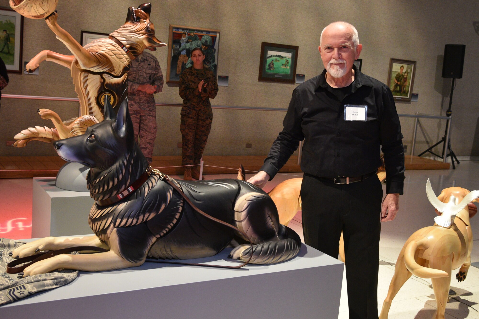 A wooden dog sculpture of former USAF military working dog Robson L096.