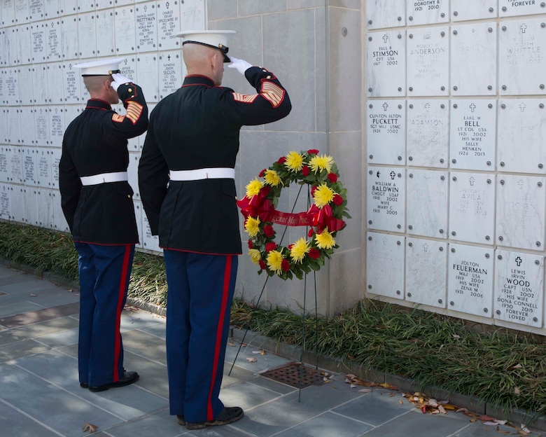 Sergeant Major of the Marine Corps Sgt. Maj. Troy E. Black, right, and Sgt. Maj. Adrian L. Tagliere salute after laying a wreath in front of the niche of Sgt. Maj. Clinton A. Puckett during a private ceremony Nov. 8 at Arlington National Cemetery. Puckett, the sixth sergeant major of the Marine Corps, was one of three veterans who were remembered during the annual wreath-laying ceremony.