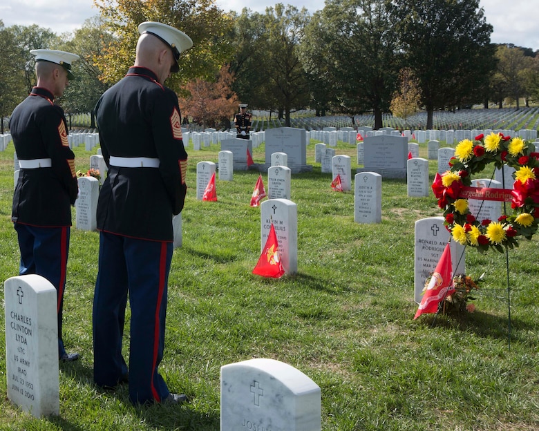 Sergeant Major of the Marine Corps Sgt. Maj. Troy E. Black, right, and Sgt. Maj. Adrian L. Tagliere bow their heads in silence after laying a wreath on the grave of Sgt. Ronald Ariel Rodriguez during a private ceremony Nov. 8 at Arlington National Cemetery. Rodriguez, who died Aug. 23, 2010, while supporting combat operations in Helmand province, Afghanistan, was one of three veterans who were remembered during the annual wreath-laying ceremony.