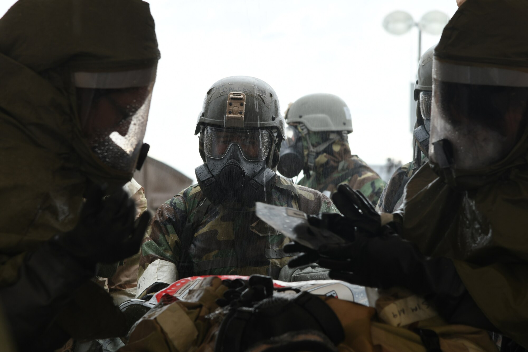 A U.S. Air Force Airman from the 355th Wing is decontaminated after a simulated chemical attack during Exercise Bushwhacker 19-08 at Libby Army Airfield, Arizona, Nov. 6, 2019. The wing is proving the Dynamic Wing deployment concept as it continues to lead the Air Force in operational readiness. (U.S. Air Force photo by Airman 1st Class Sari A. Seibert)