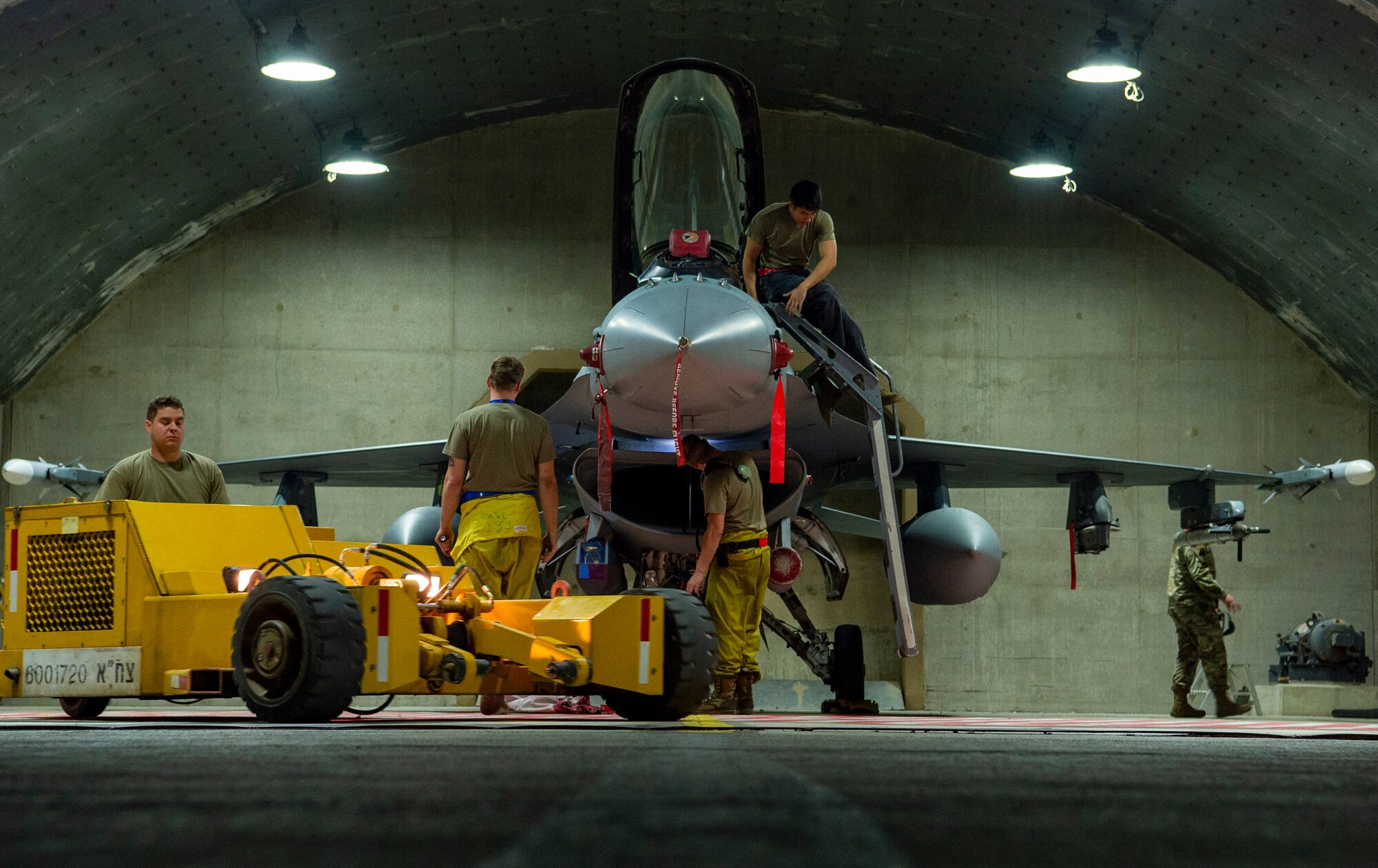 U.S. Air Force Airmen from the 52nd Aircraft Maintenance Squadron, perform post flight maintenance on an F-16 Fighting Falcon during Blue Flag 2019 at Uvda Air Base, Israel, November 6, 2019.