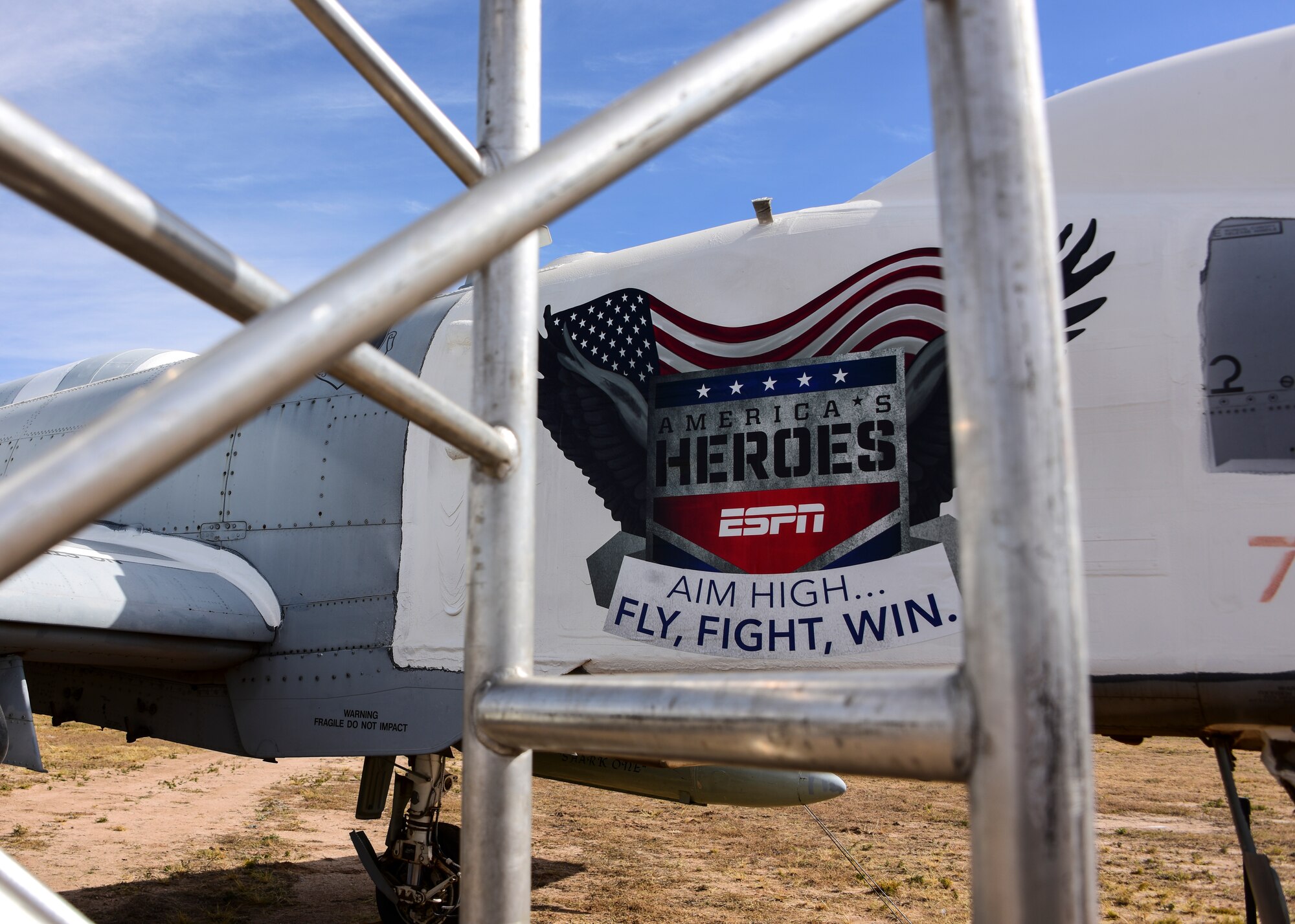 Airmen from the 355th Wing, alongside family and veterans, cheer as ESPN’s “First Take” airs from Davis-Monthan Air Force Base, Arizona, Nov. 8, 2019.