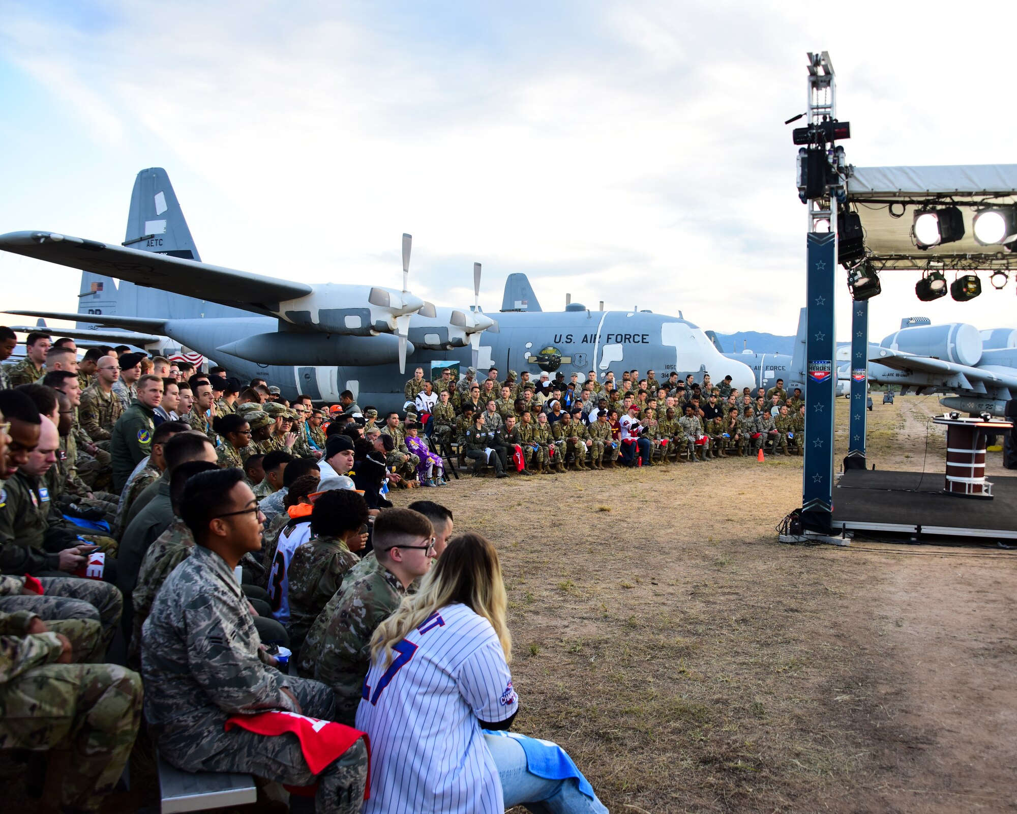 A photo of airmen cheering in the audience during an airing of ESPN's "First Take".