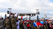 A photo of airmen cheering in the audience during an airing of ESPN's "First Take".