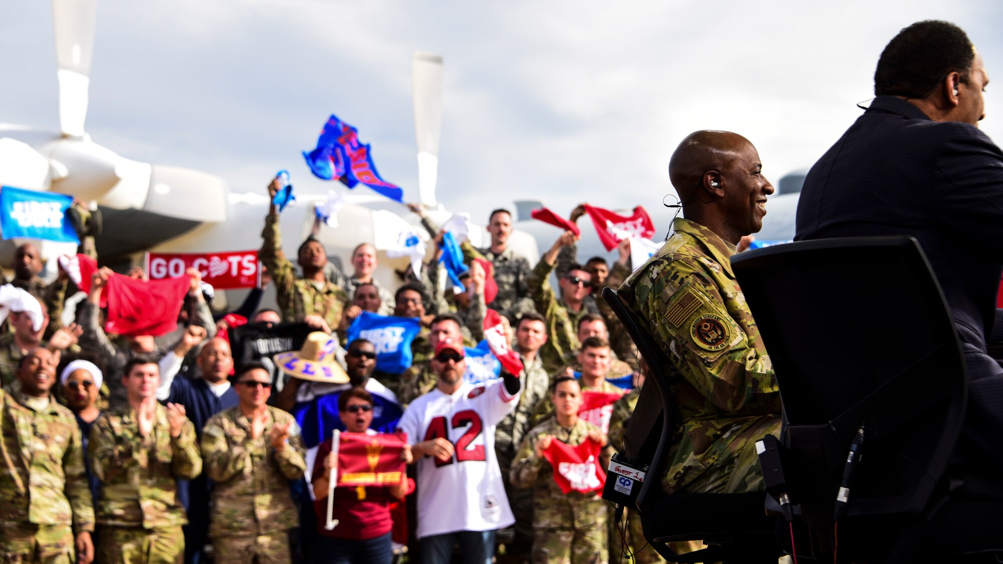 A photo of airmen cheering in the audience during an airing of ESPN's "First Take".