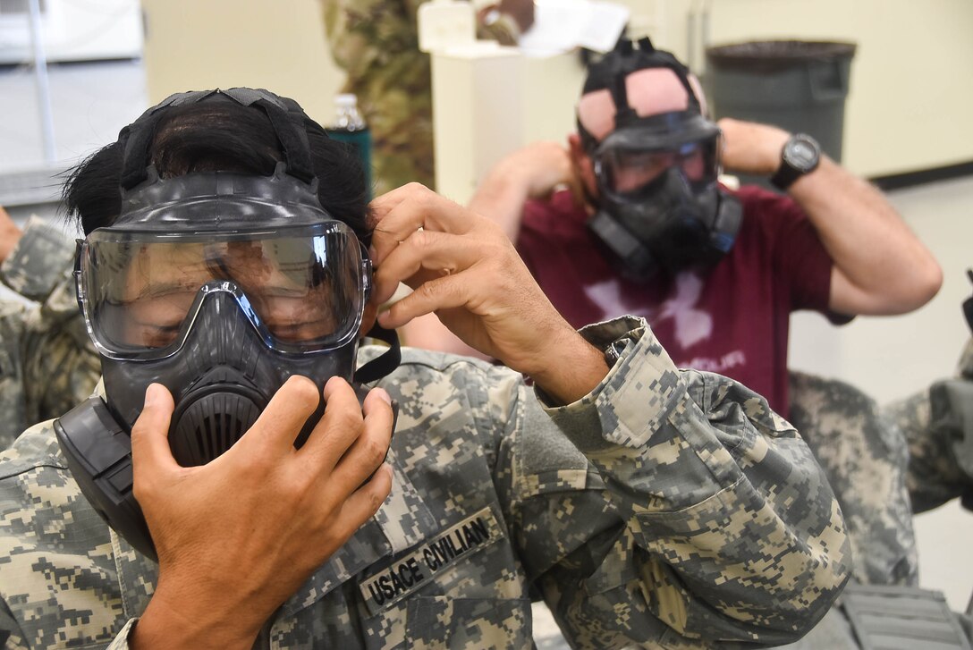 U.S. Army Corps of Engineers, Far East District, Emergency Essential Civilian (EEC) personnel and Mission Essential Civilian (MEC) personnel, practice first-aid techniques during the district's EEC training held at the Vehicle Maintenance Facility, Camp Humphreys, South Korea.