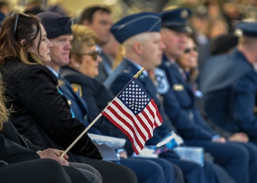 An attendee of the Albuquerque Veterans Day ceremony holds an American flag at the New Mexico Veterans Memorial Nov. 11, 2019. The public event was attended by veterans and service members from each branch of military with their families, Air Force ROTC, Junior ROTC as well as state and local government leaders. (U.S. Air Force photo by Airman 1st Class Austin J. Prisbrey)