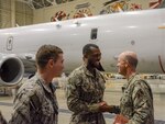 191108-N-SR472-002 KADENA AIR BASE, Japan (Nov. 8, 2019) Vice Adm. Bill Merz, commander of U.S. 7th Fleet, meets with Yeoman Specialist 3rd Class Kailin Carter during a visit to Commander, Task Force (CTF) 72. The “World Famous Pelicans” P-8 squadron is based out of Naval Air Station Jacksonville.  CTF 72 leads patrol, reconnaissance and surveillance forces in support of U.S. 7th fleet.