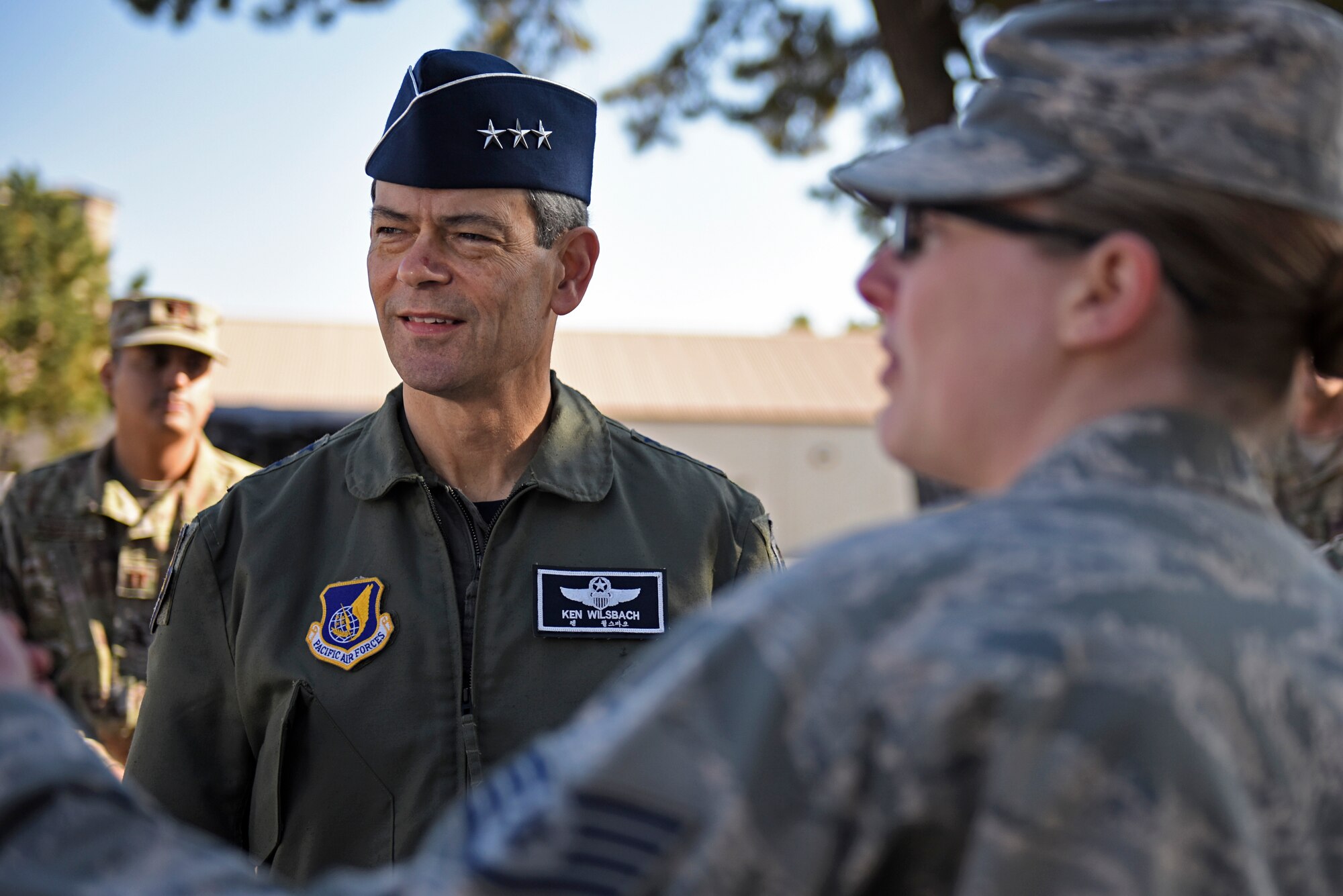 U.S. Air Force Lt. Gen. Ken Wilsbach, 7th Air Force commander, speaks with Staff Sgt. Loren Boring, 8th Civil Engineer Squadron craftsman, during a base visit at Kunsan Air Base, Republic of Korea, Nov. 7, 2019. Wilsbach learned about how the 8th Civil Engineer Squadron is paving the way for future Airmen to operate and accomplish their mission in safer and healthier environments. (U.S. Air Force photo by Staff Sgt. Mackenzie Mendez)