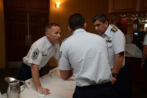 Photo of members of the South American Air Chiefs and Senior Enlisted Leaders Conference talk