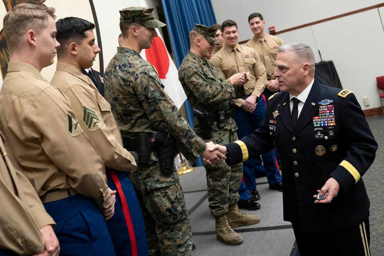 Army Gen. Mark A. Milley shakes hands with troops.