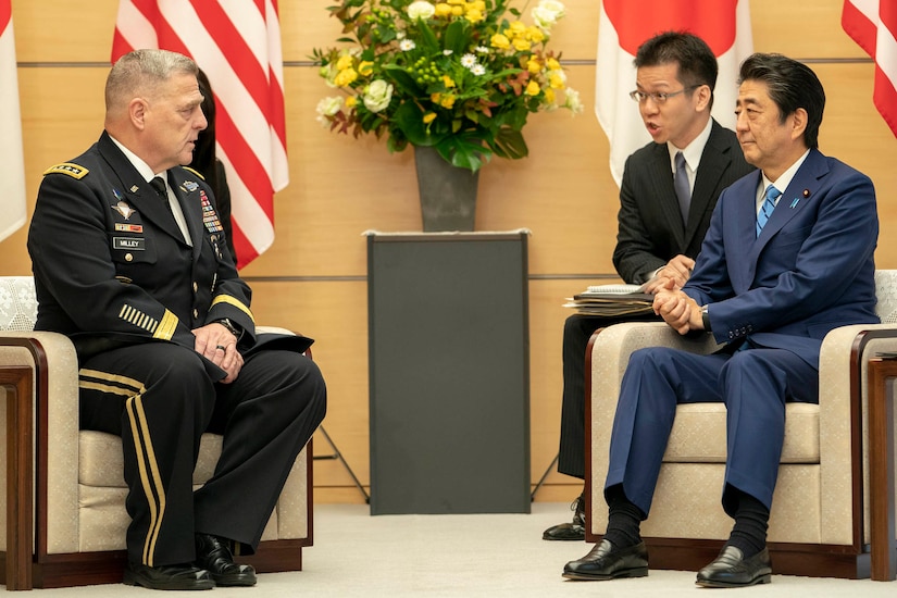 Army Gen. Mark A. Milley, chairman of the Joint Chiefs of Staff, sits next to Japanese Prime Minister Shinzo Abe.