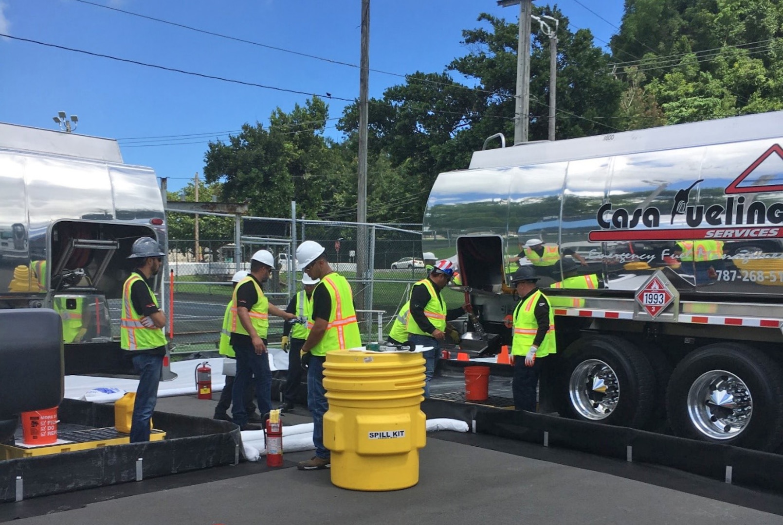 DLA Energy fuel contractors perform truck-to-truck transfer operations and prepare for truck-to-vehicle fueling operations