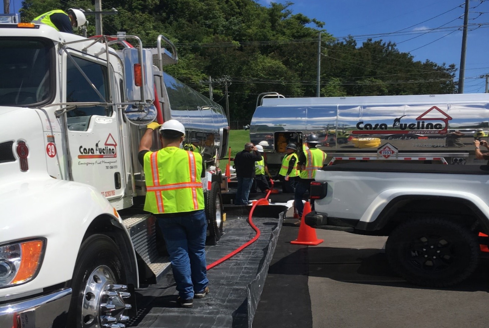 DLA Energy fuel contractors perform truck-to-truck transfer operations and prepare for truck-to-vehicle fueling operations