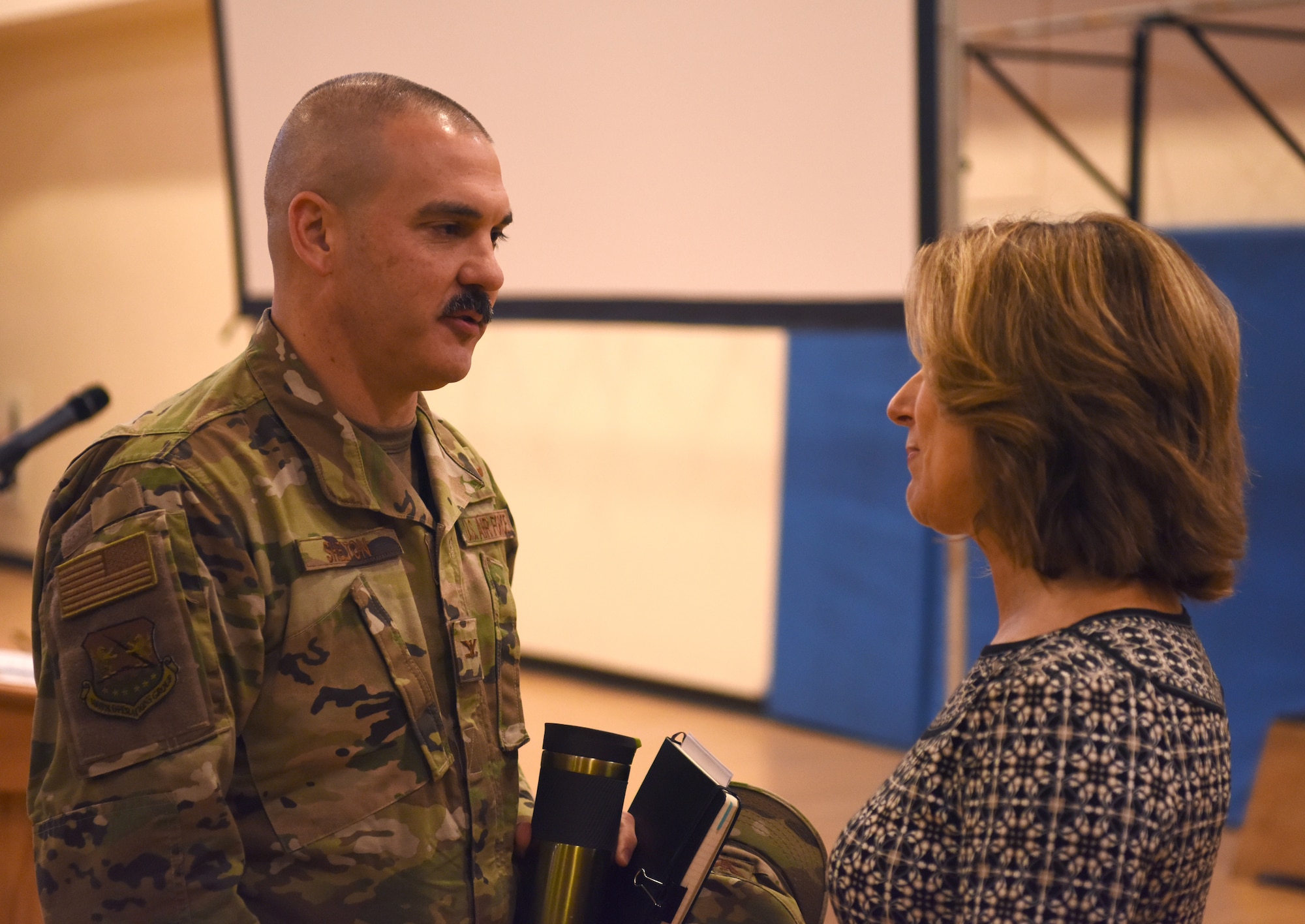Colonel Robert Shelton, 100th Operations Group commander, speaks with Gill Hayes, a mental health and suicide prevention speaker, during a Resiliency Tactical Pause at RAF Mildenhall, England, Nov. 7, 2019. The two-day event, which was originally based on a directive by the Air Force Chief of Staff Gen. David L. Goldfein and Command Chief Master Sgt. of the Air Force Kaleth O. Wright, included two guest speakers, an overview of base helping agencies and various small unit discussions. (U.S. Air Force photo by Senior Airman Brandon Esau)