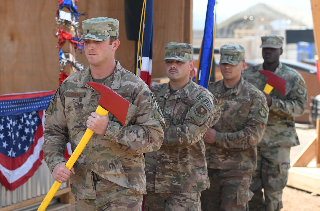 Members of the 776th Expeditionary Air Base Squadron Fire Department serve as honor guard during the first Veteran’s Day Ceremony held at Chabelley Airfield, Djibouti, Nov. 11, 2019. The 776th EABS Airmen held the inaugural ceremony to honor the service members that preceded them, especially the prior service contractors who work on the installation. (U.S. Air Force photo by Staff Sgt. Alex Fox Echols III)