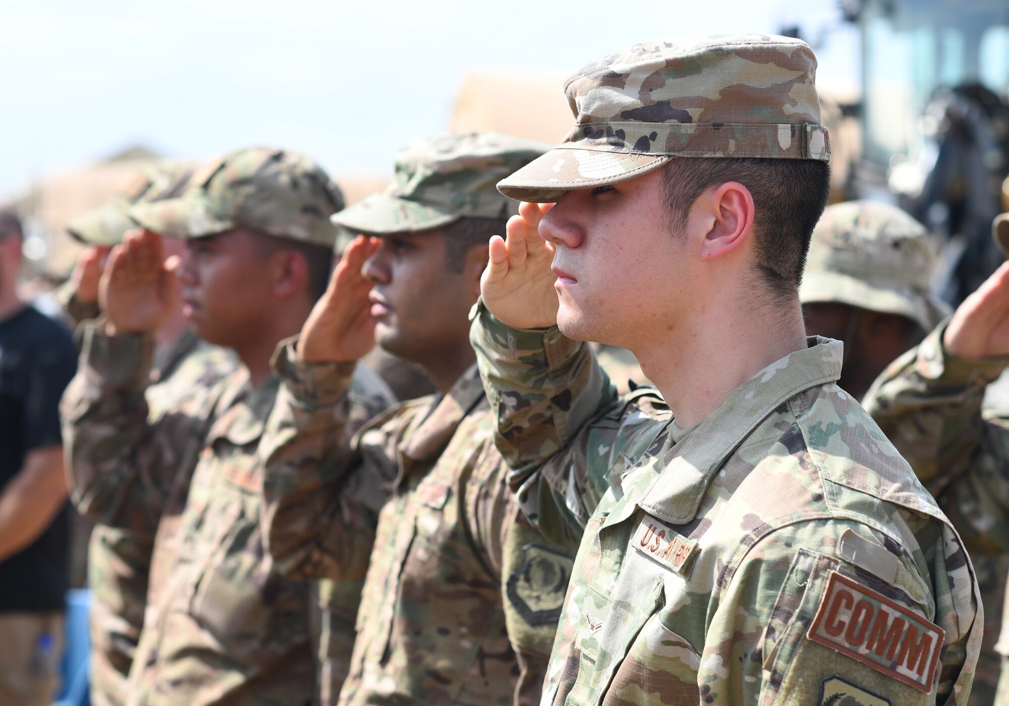 U.S. Airmen deployed to the 776th Expeditionary Air Base Squadron salute during the first Veteran’s Day Ceremony held at Chabelley Airfield, Djibouti, Nov. 11, 2019. The 776th EABS Airmen held the inaugural ceremony to honor the service members that preceded them, especially the prior service contractors who work on the installation. (U.S. Air Force photo by Staff Sgt. Alex Fox Echols III)