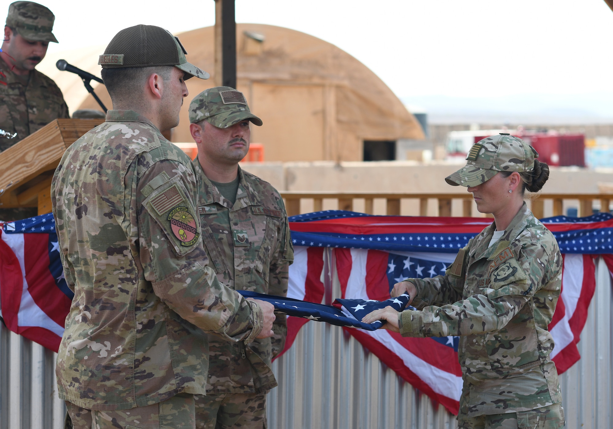 U.S. Airmen deployed to the 776th Expeditionary Air Base Squadron perform a flag folding ceremony during the first Veteran’s Day event held at Chabelley Airfield, Djibouti, Nov. 11, 2019. The 776th EABS Airmen held the inaugural ceremony to honor the service members that preceded them, especially the prior service contractors who work on the installation. (U.S. Air Force photo by Staff Sgt. Alex Fox Echols III)