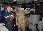 U.S. Navy Capt. Chris. D. Stone, the commanding officer of the guided-missile cruiser USS Normandy (CG 60), gives a tour of the ship's pilot house to the commanding officer of the French Navy ship Jean Bart during International Maritime Exercise 2019 (IMX 19). The exercise is a multinational engagement involving partners and allies from around the world designed to facilitate the sharing of knowledge and experiences across the full spectrum of defensive maritime operations. IMX 19 serves to demonstrate the global resolve in maintaining regional security and stability, freedom of navigation and the free flow of commerce from the Suez Canal south to the Bab el-Mandeb Strait through the Strait of Hormuz to the Northern Arabian Gulf. (U.S. Navy photo by Mass Communication Specialist 2nd Class Michael H. Lehman)