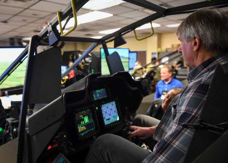 Albert Prast, a Joint Civilian Orientation Conference participant, operates a CH-47 Chinook helicopter flight simulator at Joint Base Langley-Eustis, Virginia, Nov. 6, 2019.