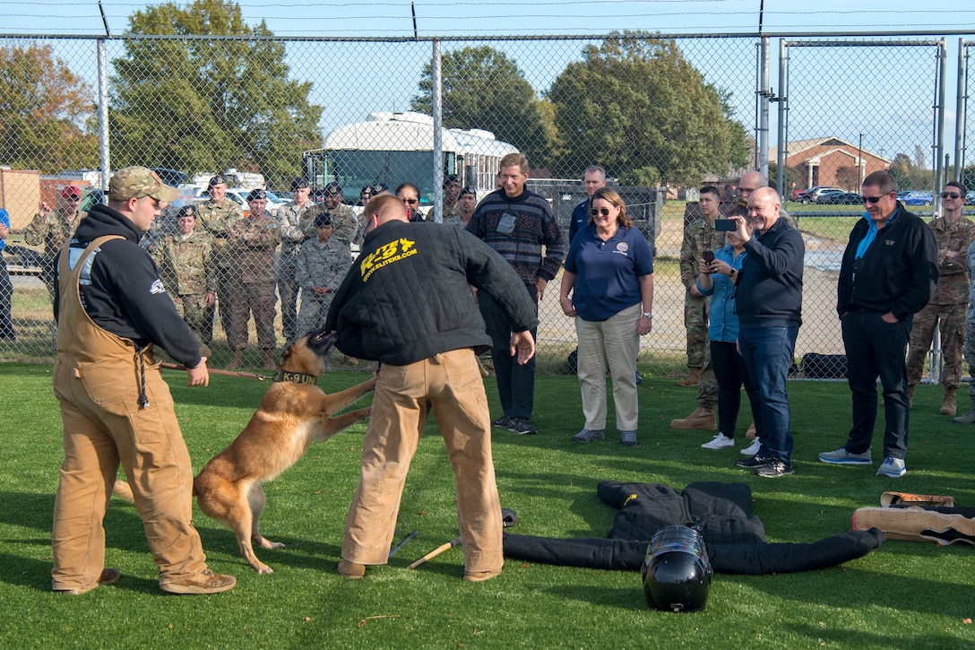 Joint Civilian Orientation Conference participants watch a 633rd Security Forces Squadron military working dog demonstration at Joint Base Langley-Eustis, Virginia, Nov. 7, 2019.