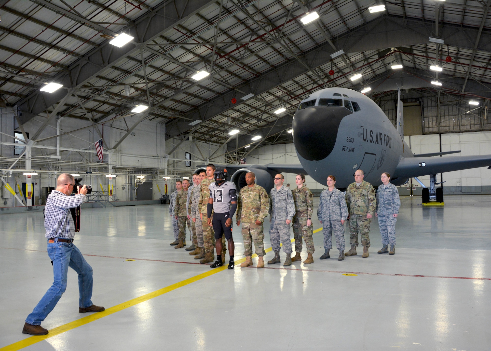 An Oklahoma State University video crew visits the 507th Air Refueling Wing and takes footage of their military appreciation uniform with and in a KC-135R Stratotanker Oct. 9, 2019, at Tinker Air Force Base, Oklahoma. (U.S. Air Force photo by Tech. Sgt. Samantha Mathison)