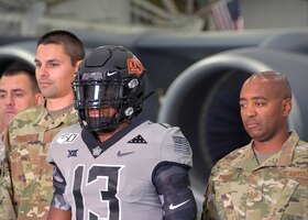 An Oklahoma State University video crew visits the 507th Air Refueling Wing and takes footage of their military appreciation uniform with and in a KC-135R Stratotanker Oct. 9, 2019, at Tinker Air Force Base, Oklahoma. (U.S. Air Force photo by Tech. Sgt. Samantha Mathison)