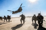 Soldiers maintain security as a CH-47 Chinook departs the HLZ during an air assault training exercise in the National Training Center, California, Jan. 25, 2017. The purpose of this mission was to demonstrate the troop's ability to carry out complex attacks while enhancing the unit's ability of employing aviation resources.