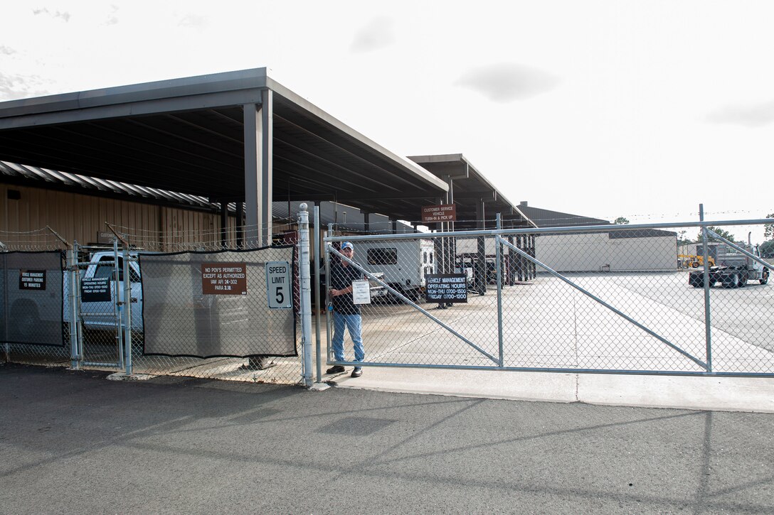 An Airman assigned to the 23d Logistics Readiness Squadron (LRS) closes the gate to secure assets Nov. 6, 2019, at Moody Air Force Base, Ga. The 23d LRS vehicle management section is responsible for the maintenance and upkeep of 432 of Moody’s government-owned vehicles. (U.S. Air Force photo by Airman 1st Class Jasmine M. Barnes)