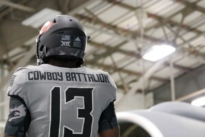 An Oklahoma State University video crew visits the 507th Air Refueling Wing and takes footage of their military appreciation uniform with and in a KC-135R Stratotanker Oct. 9, 2019, at Tinker Air Force Base, Oklahoma. (U.S. Air Force photo by Senior Airman Mary Begy)