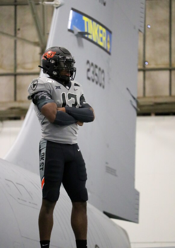 An Oklahoma State University video crew visits the 507th Air Refueling Wing and takes footage of their military appreciation uniform with and in a KC-135R Stratotanker Oct. 9, 2019, at Tinker Air Force Base, Oklahoma. (U.S. Air Force photo by Senior Airman Mary Begy)