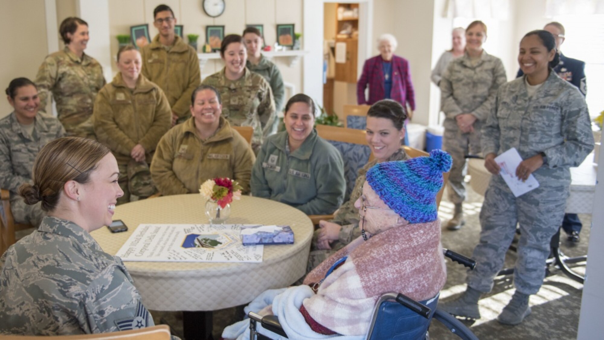 U.S. Air Force Airmen, assigned to the Massachusetts Air National Guard’s 102nd Intelligence Wing, wish fellow Airman, U.S. Army Air Corps veteran Della Sassa a happy 102nd birthday at the Royal Cape Cod Nursing and Rehabilitation Center in Buzzards Bay Mass. on November 8, 2019. (U.S. Air National Guard photo by Tech. Sgt. Thomas Swanson)