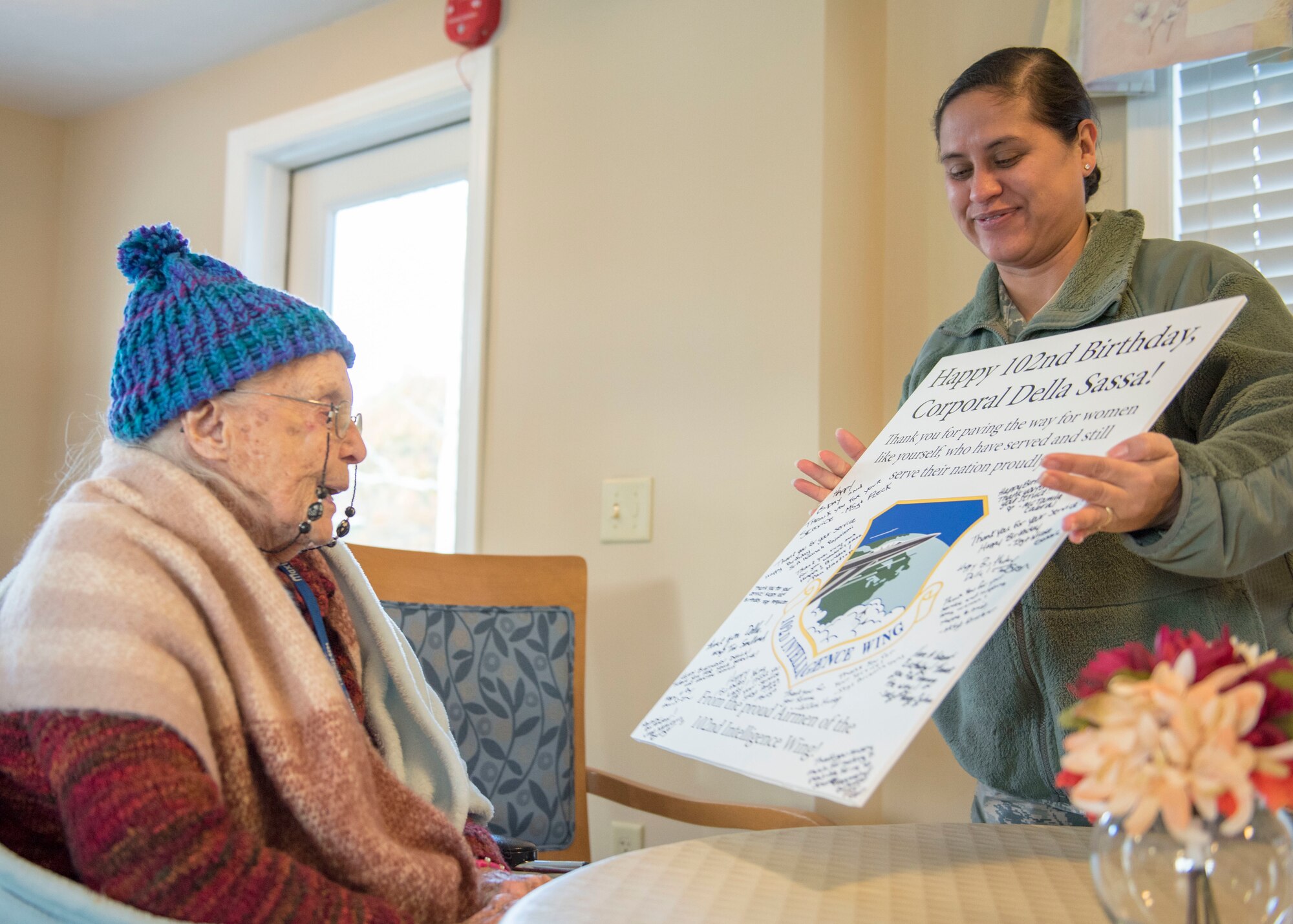 U.S. Air Force Airmen from the Massachusetts Air National Guard’s 102nd Intelligence Wing wish fellow Airman, U.S. Army Air Corps veteran Della Sassa a happy 102nd birthday at the Royal Cape Cod Nursing and Rehabilitation Center in Buzzards Bay Mass. on November 8, 2019. (U.S. Air National Guard photo by Tech. Sgt. Thomas Swanson)
