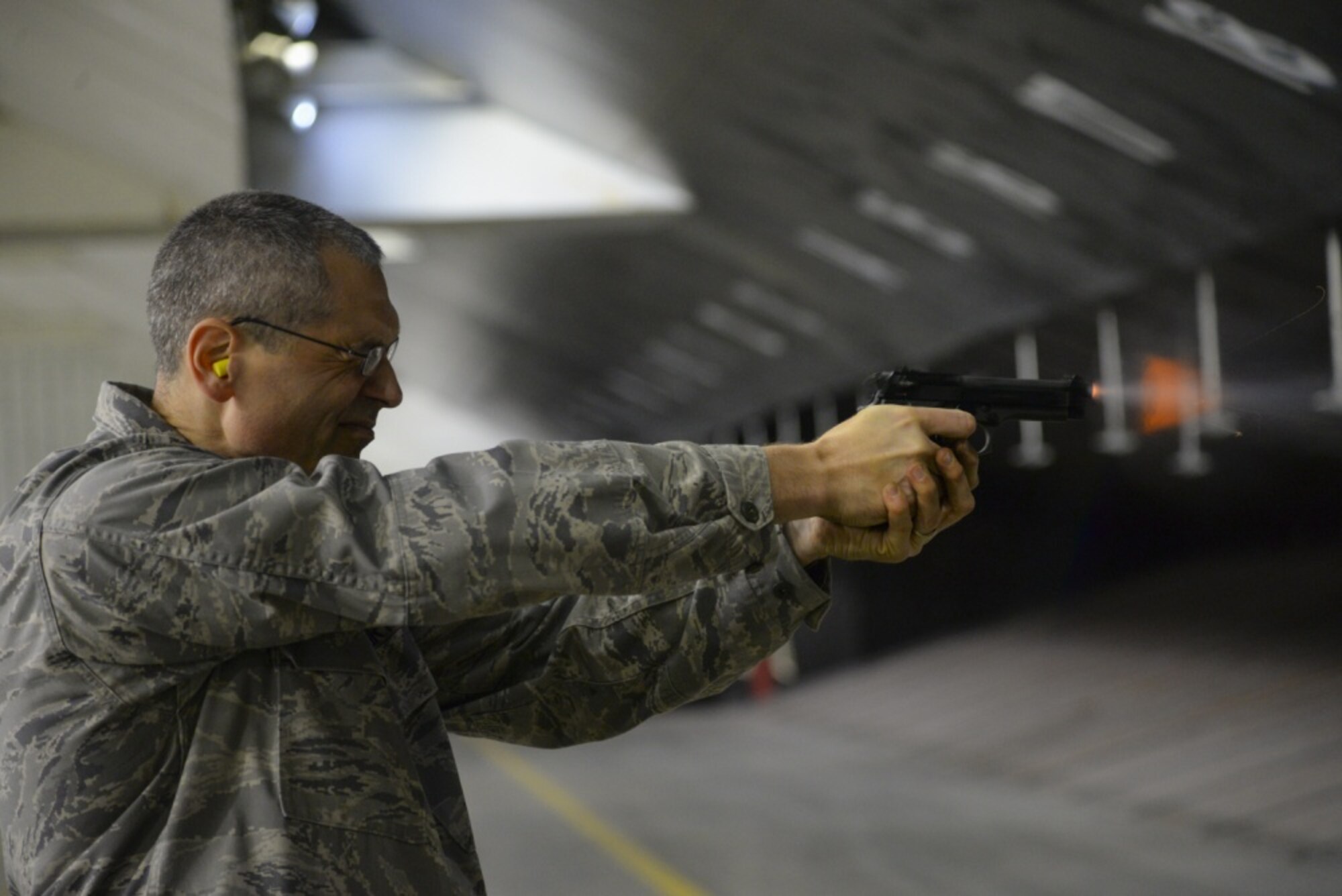 U.S. Air Force Lieutenant Colonel Eric Erickson, the Medical Group commander from the 177th Fighter Wing, New Jersey Air National Guard, fires the M9 pistol during weapons qualification training at the Transportation Security Administration firing range in Egg Harbor Township, N.J. on Nov. 5, 2019. Erickson, along with the 177th Fighter Wing commander and group commanders, took the security forces proficiency fire course, to experience a base Defender’s job. (U.S. Air National Guard photo by Senior Master Sgt. Andrew J. Moseley)