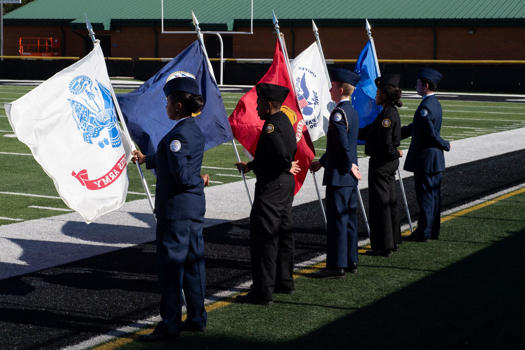 A photo of junior ROTC members presenting flags during a Veterans Day Observance