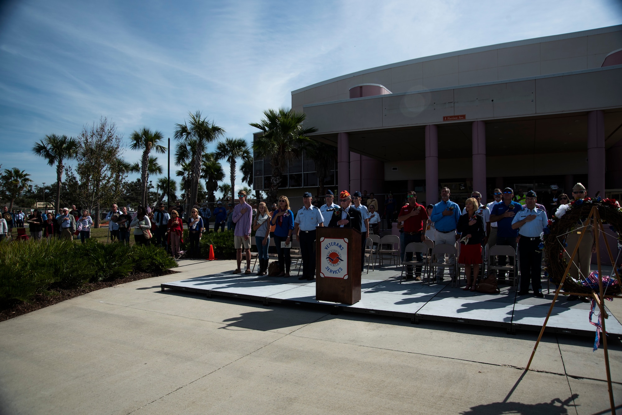 A master of ceremony delivers a speech at a Veterans Day parade celebration and wreath laying ceremony on Nov. 11, 2019, at Panama City, Florida. The annual event celebrated those who served in the past and to honor the sacrifices made by the service member as well as their families, both at home and abroad. The ceremony showcased significant songs, such as God Bless America and the National Anthem, and the wreath was put at the foot of the flag by a three-man team represented by the U.S. Navy and the Marines. (U.S. Air Force photo by Staff Sgt. Magen M. Reeves)