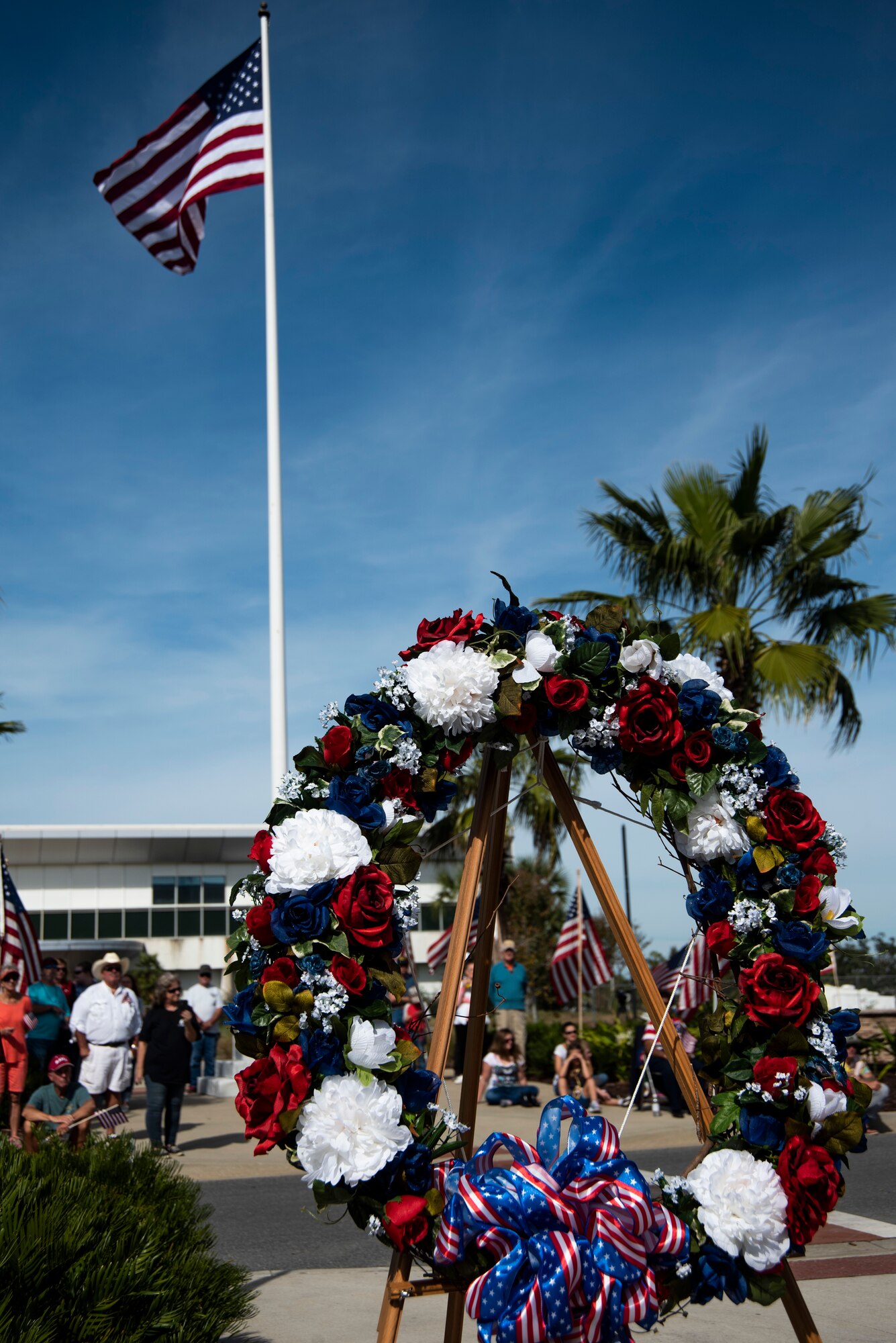 A wreath and United States flag is pictured at a Veterans Day parade celebration and wreath laying ceremony on Nov. 11, 2019, at Panama City, Florida. The annual event celebrated those who served in the past and to honor the sacrifices made by the service member, as well as their families, both at home and abroad. The ceremony showcased significant songs, such as God Bless America and the National Anthem, and the wreath was placed at the foot of the flag by a three-man team represented by the U.S. Navy and the Marines. Laidlaw thanked many local community members who served in prior conflicts and also thanked Bay County for supporting their veterans. (U.S. Air Force photo by Staff Sgt. Magen M. Reeves)