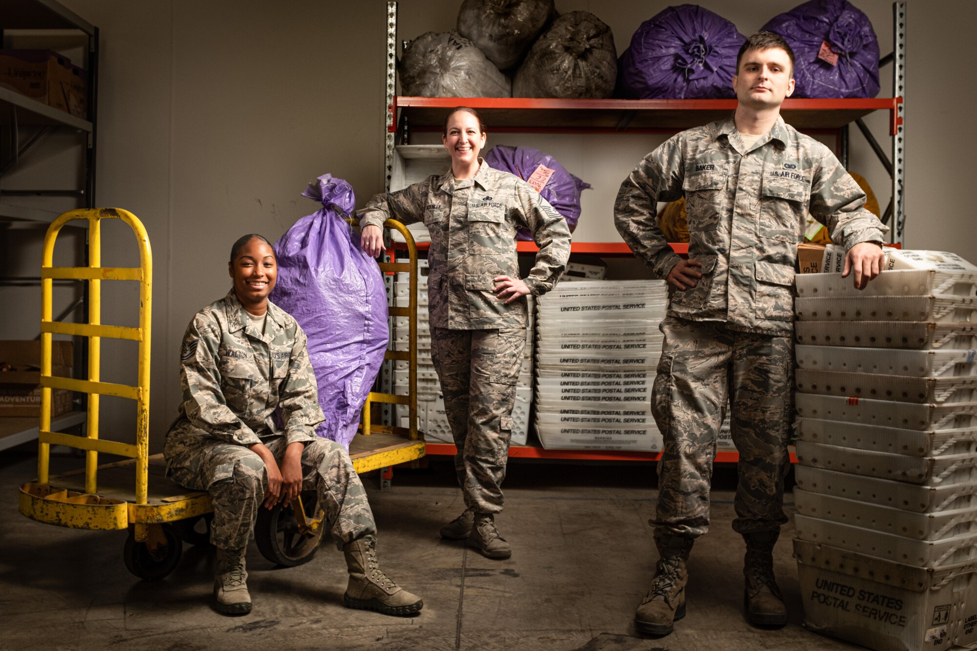 Members of the Pacific Air Forces Air Postal Squadron Detachment 4 pose for a group photo in this composite image in Sydney August 24, 2019. The detachment is responsible for delivering mail to government employees and their families located across an area of more than 3 million square miles. (U.S. Air Force Photo Illustration by Master Sgt. Benjamin Wilson)