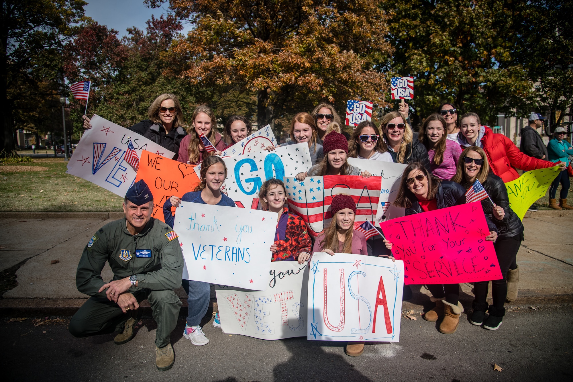 Col. Glenn Collins, commander, 932nd Airlift Wing, takes a photo moment and poses with attendees at the St. Louis Veterans Day Parade, downtown St. Louis, Missouri, Nov. 9, 2019.(U.S. Air Force photo by Christopher Parr)